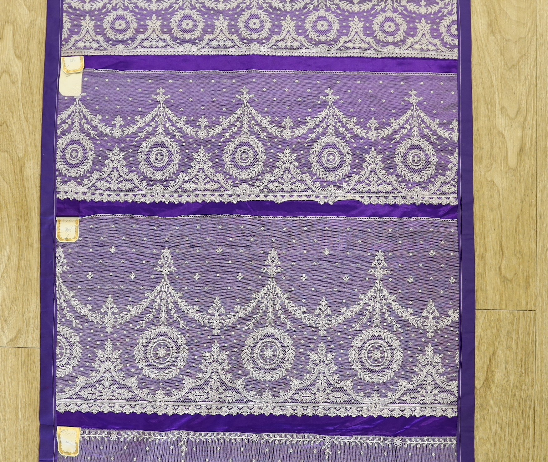 A late 19th, early 20th century retail sample display of various lace designs